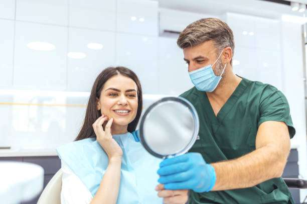 Woman enjoying her smile in the dental office
