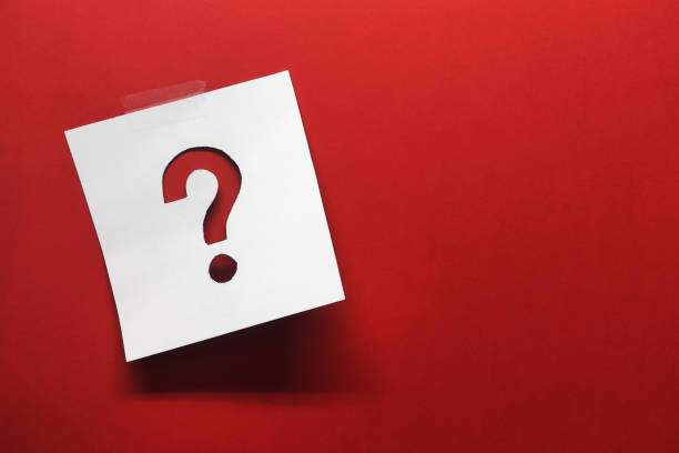 Note paper with question mark on red background