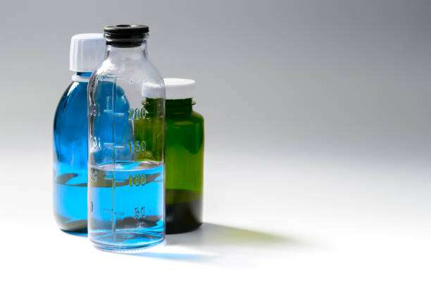 colored medial bottles on gray background with copyspace.